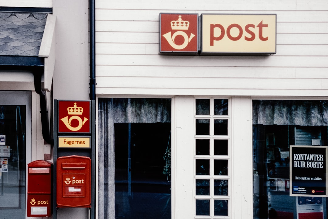 A post office with a crown on the front of it